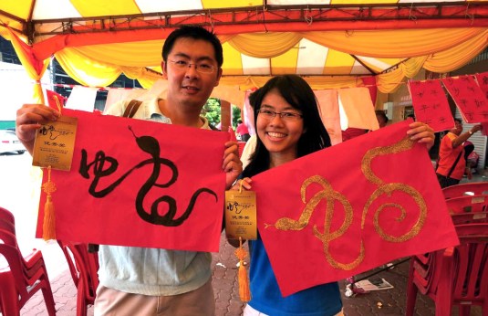 Happy posing with our medals and calligraphy.It feels good to win :)