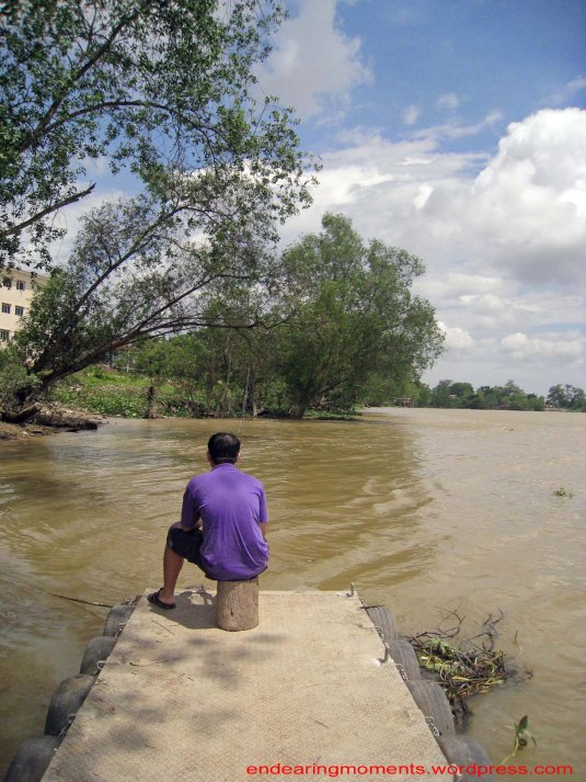 Waiting patiently on the best fishing spot available.