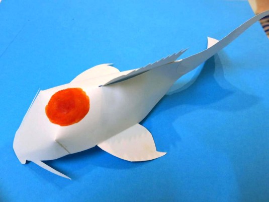 Step 5: Paint the most prominent part of the fish pattern.